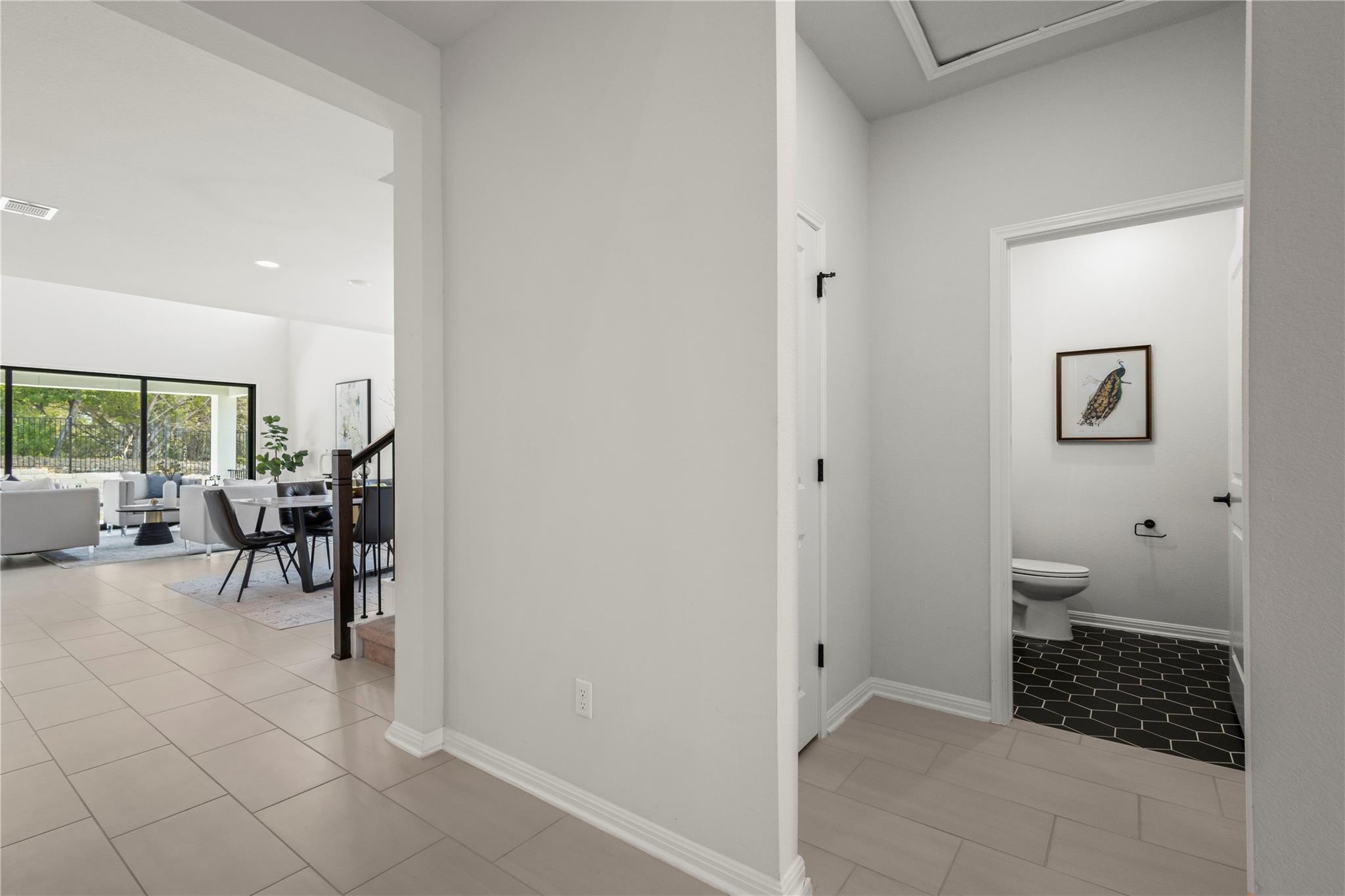 1128 Villa Rialto View Leander, TX 78641 - Photo 10 of 40 Hallway featuring light tile patterned flooring and recessed lighting