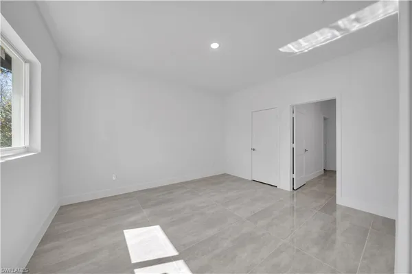 a view of an empty room with a window