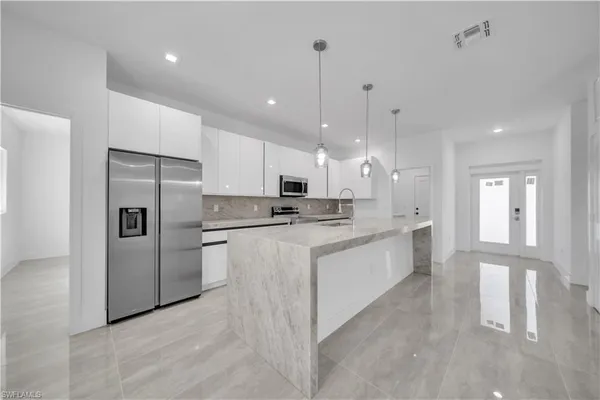 a large kitchen with cabinets