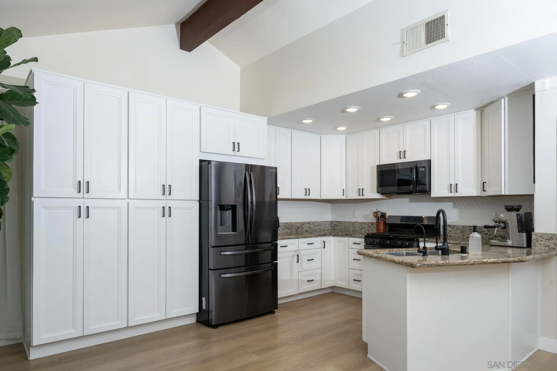 10354 Settle Road Santee, CA 92071 - Photo 12 of 56 a kitchen with stainless steel appliances a refrigerator sink and cabinets