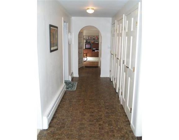 17 Donna Road Chelmsford, MA 01824 - Photo 5 of 12 a view of a hallway with a white walls and stairs