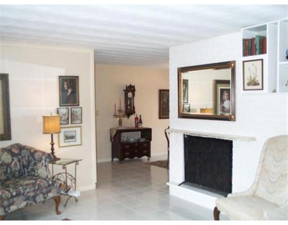 17 Donna Road Chelmsford, MA 01824 - Photo 8 of 12 a living room with furniture a mirror and a fireplace