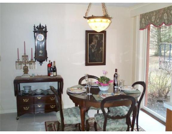 17 Donna Road Chelmsford, MA 01824 - Photo 9 of 12 a view of a dining room with furniture and chandelier