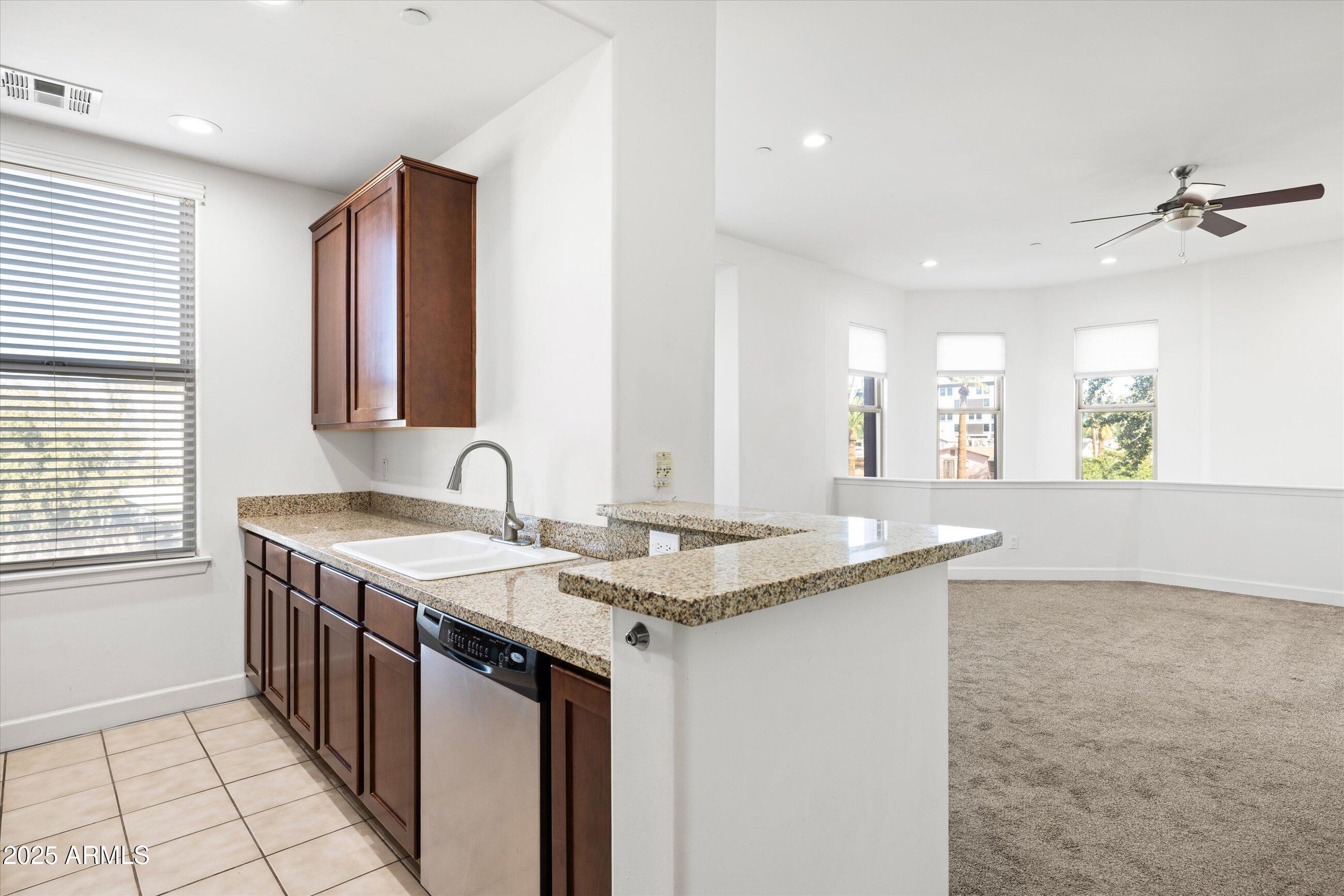 505 West 6th Street Tempe, AZ 85281 - Photo 14 of 32 a kitchen with a sink stove and cabinets