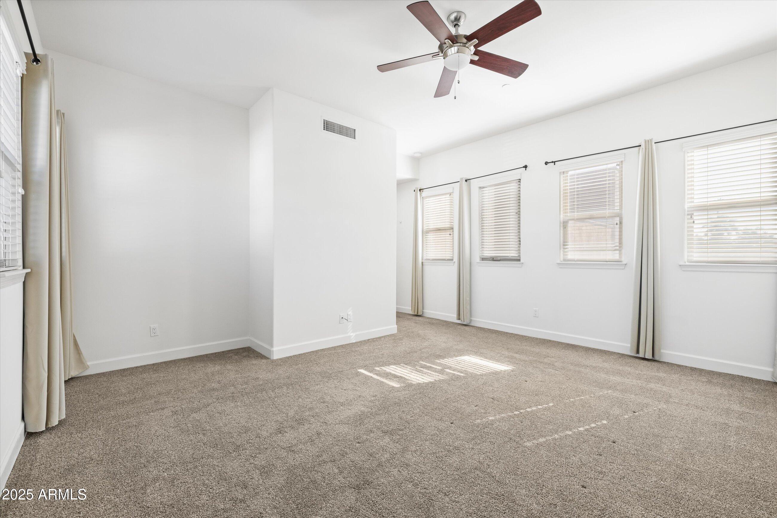 505 West 6th Street Tempe, AZ 85281 - Photo 18 of 32 an empty room with windows and fan