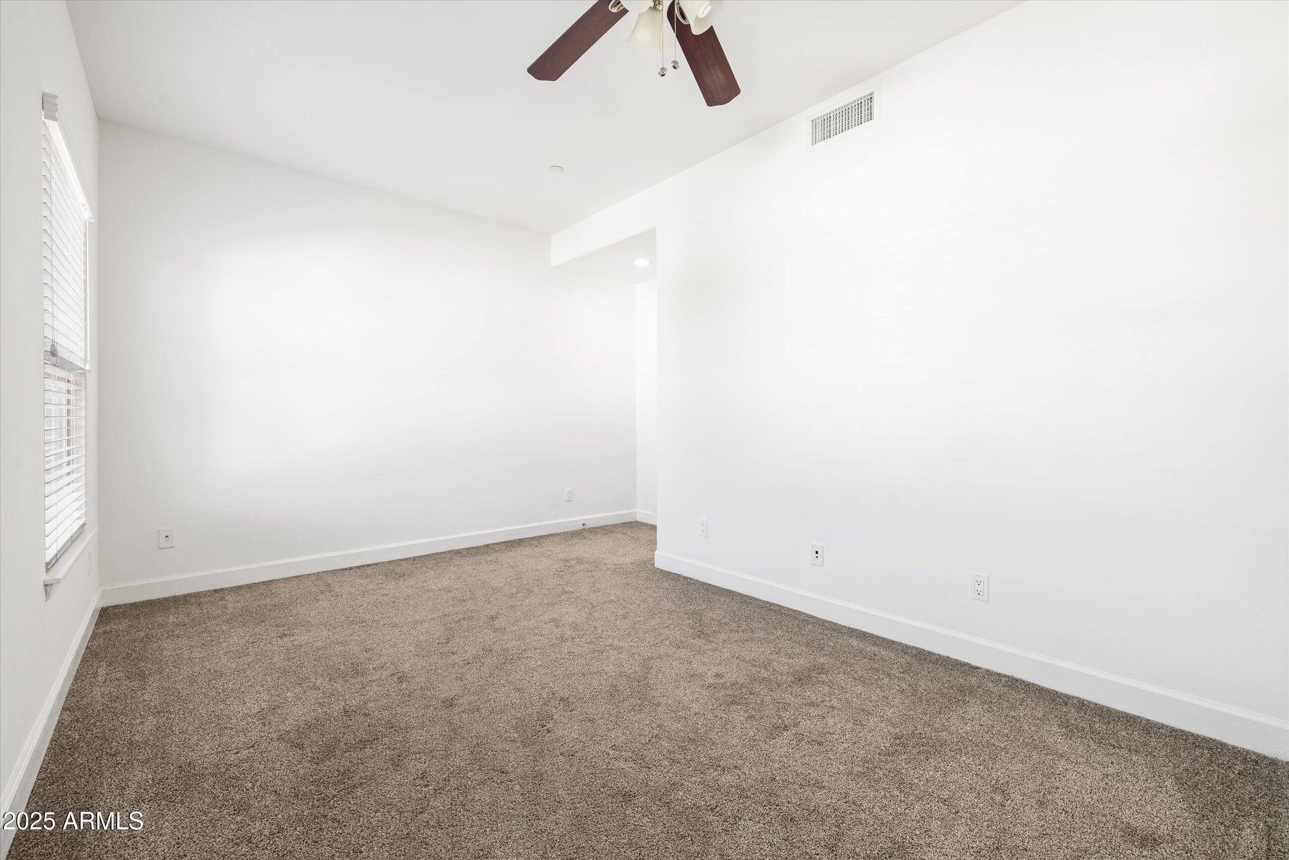 505 West 6th Street Tempe, AZ 85281 - Photo 22 of 32 an empty room with ceiling fan