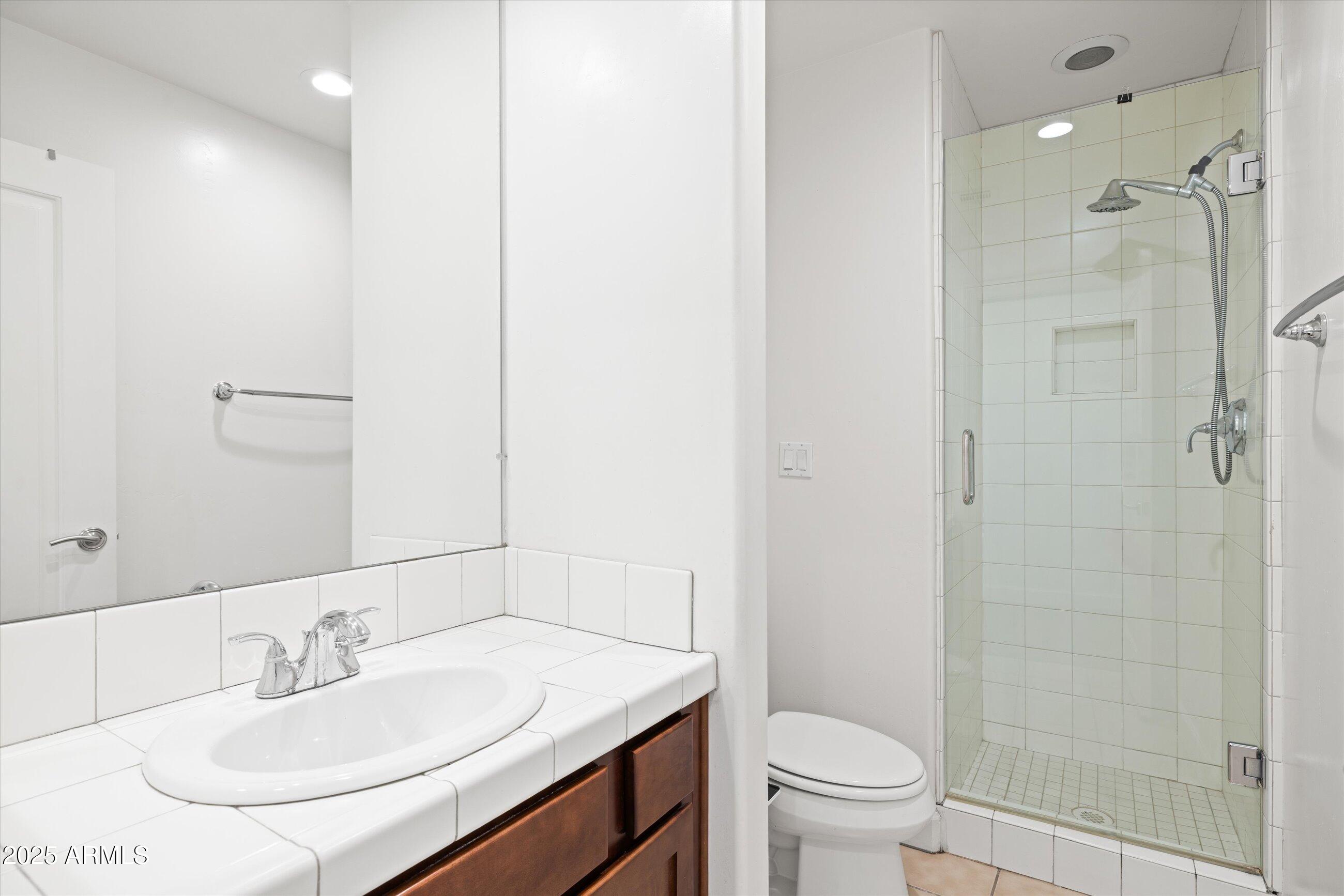 505 West 6th Street Tempe, AZ 85281 - Photo 23 of 32 a bathroom with a sink toilet and shower