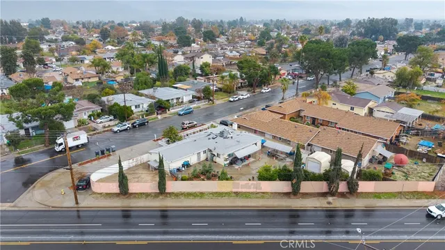 an aerial view of a houses with yard