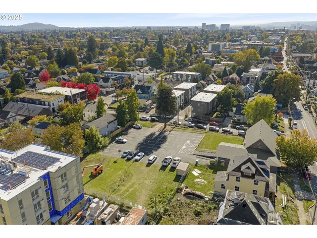 an aerial view of residential house with outdoor space and swimming pool