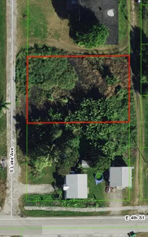 an aerial view of a house with a yard and potted plants