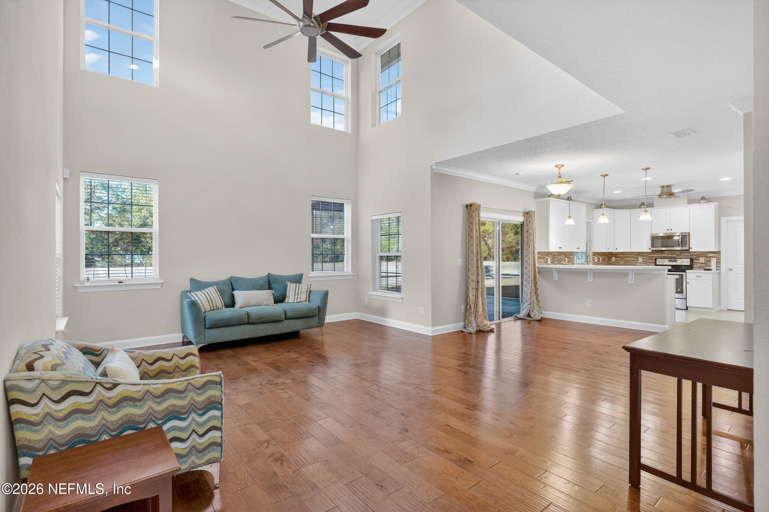 13576 Dunn Creek Road Jacksonville, FL 32218 - Photo 18 of 54 a living room with furniture and kitchen view