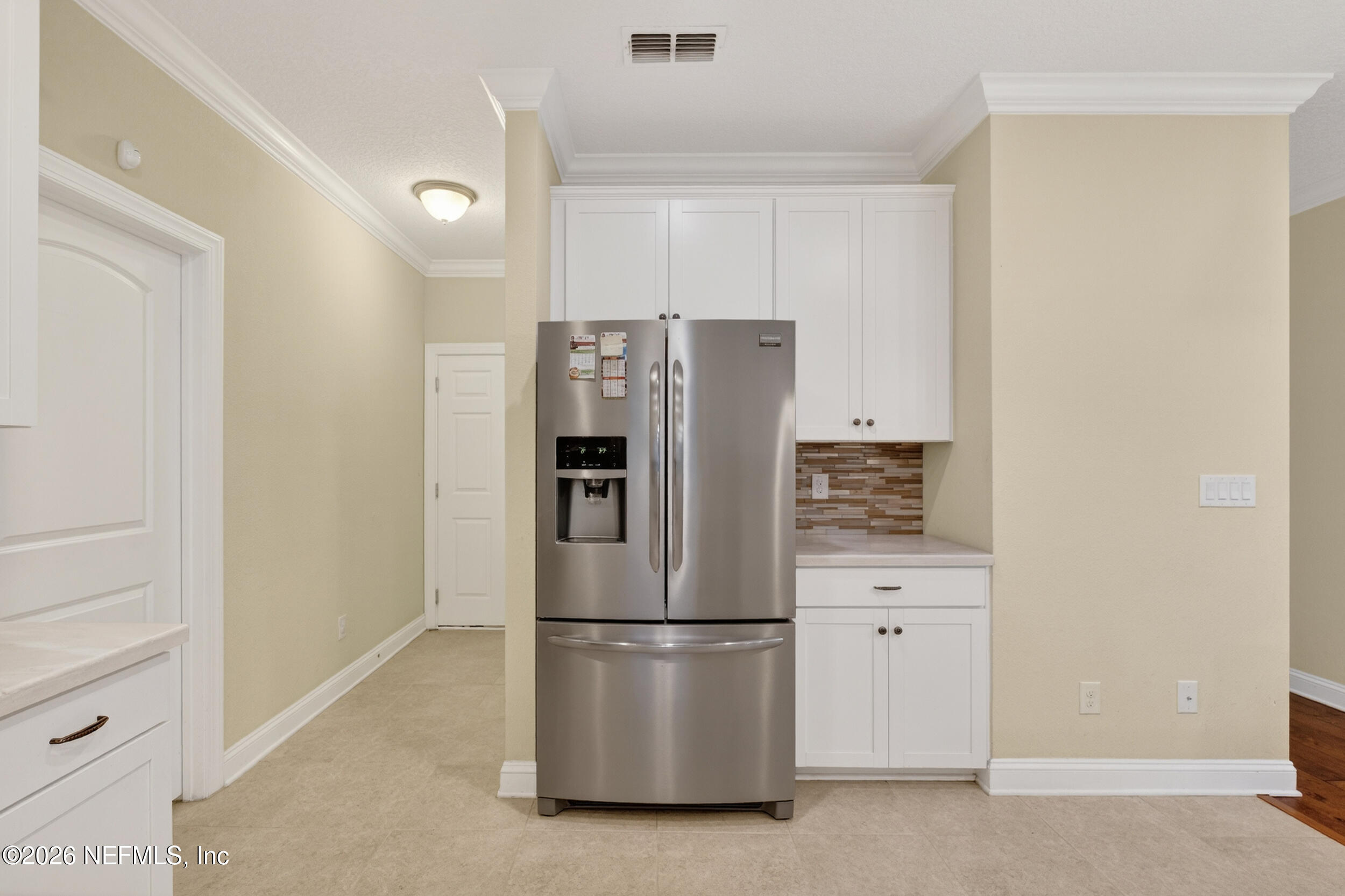 13576 Dunn Creek Road Jacksonville, FL 32218 - Photo 24 of 54 a refrigerator freezer sitting in a kitchen