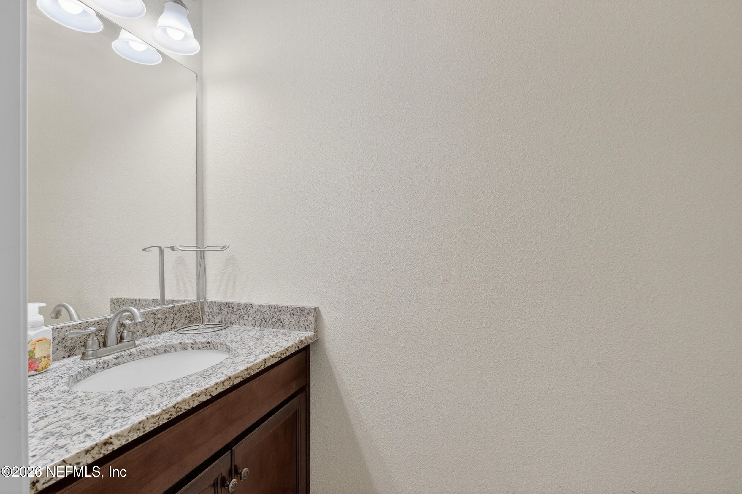 13576 Dunn Creek Road Jacksonville, FL 32218 - Photo 28 of 54 a bathroom with a granite countertop sink and a mirror