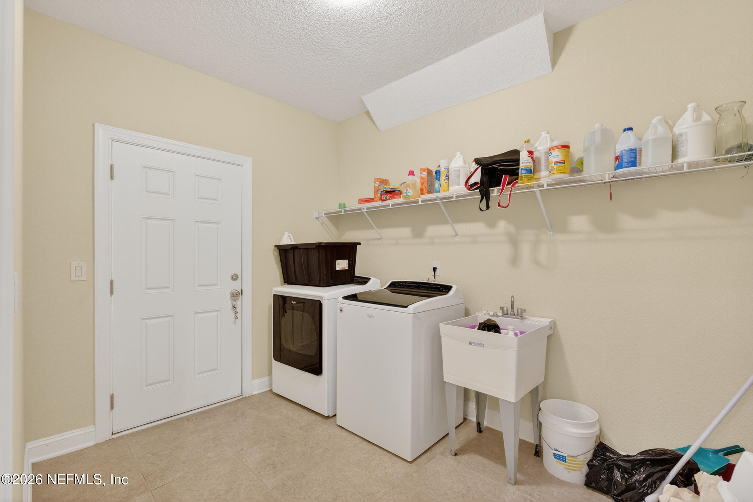 13576 Dunn Creek Road Jacksonville, FL 32218 - Photo 29 of 54 a utility room with sink dryer and washer