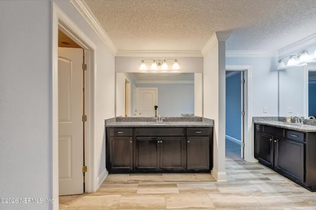 a kitchen with a sink and a stove top oven
