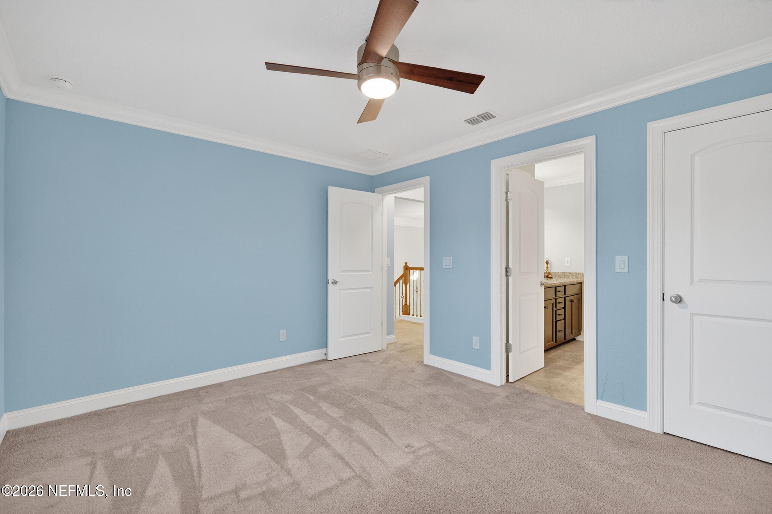 13576 Dunn Creek Road Jacksonville, FL 32218 - Photo 44 of 54 a view of empty room with a ceiling fan