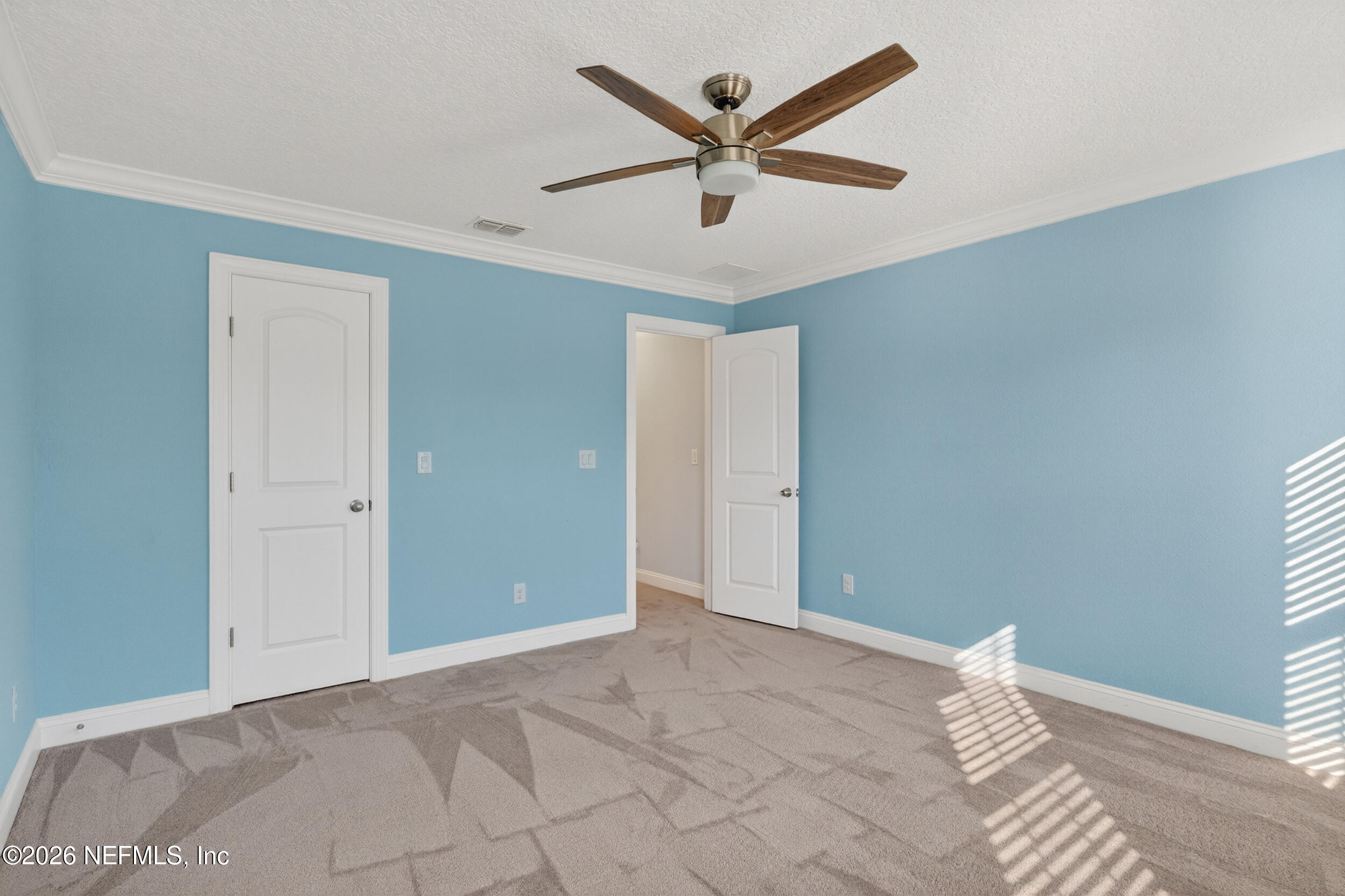 13576 Dunn Creek Road Jacksonville, FL 32218 - Photo 46 of 54 a view of a livingroom with a ceiling fan and wooden floor