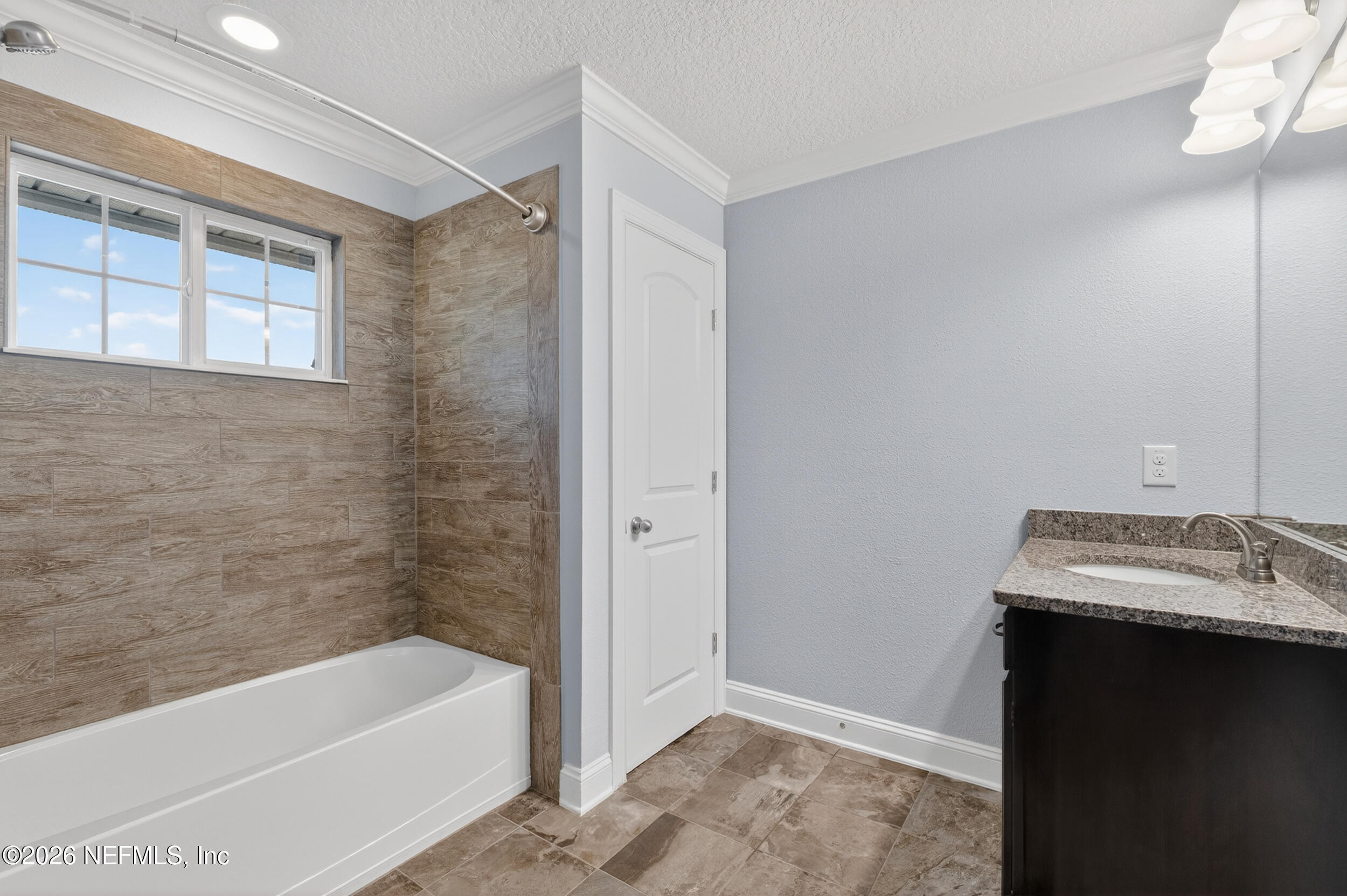 13576 Dunn Creek Road Jacksonville, FL 32218 - Photo 47 of 54 a bathroom with a tub sink and a toilet