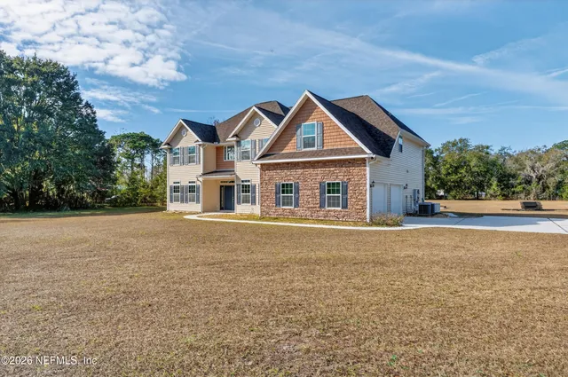 a vase of flowers sitting on a floor