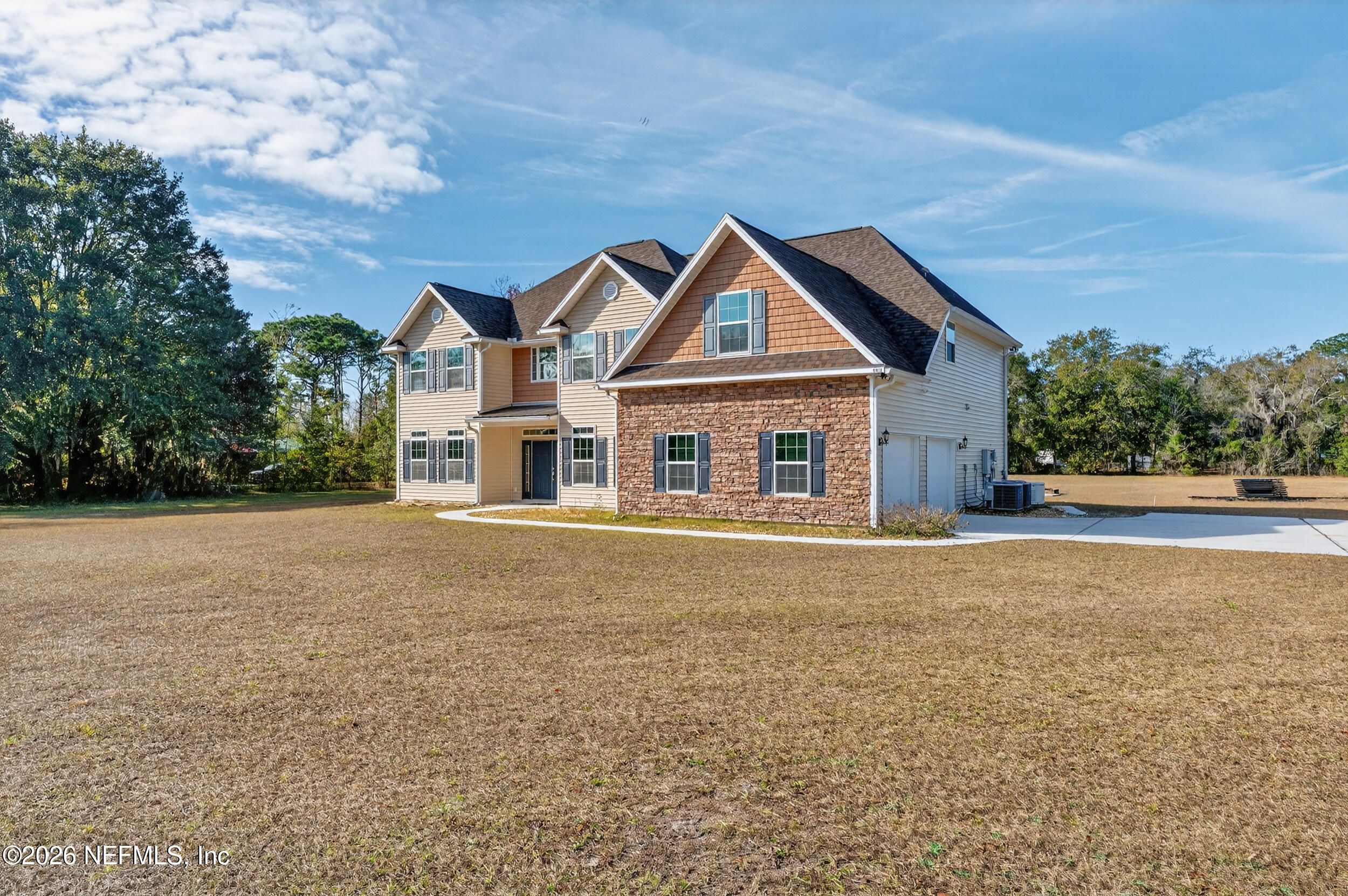 13576 Dunn Creek Road Jacksonville, FL 32218 - Photo 49 of 54 front view of house with a yard