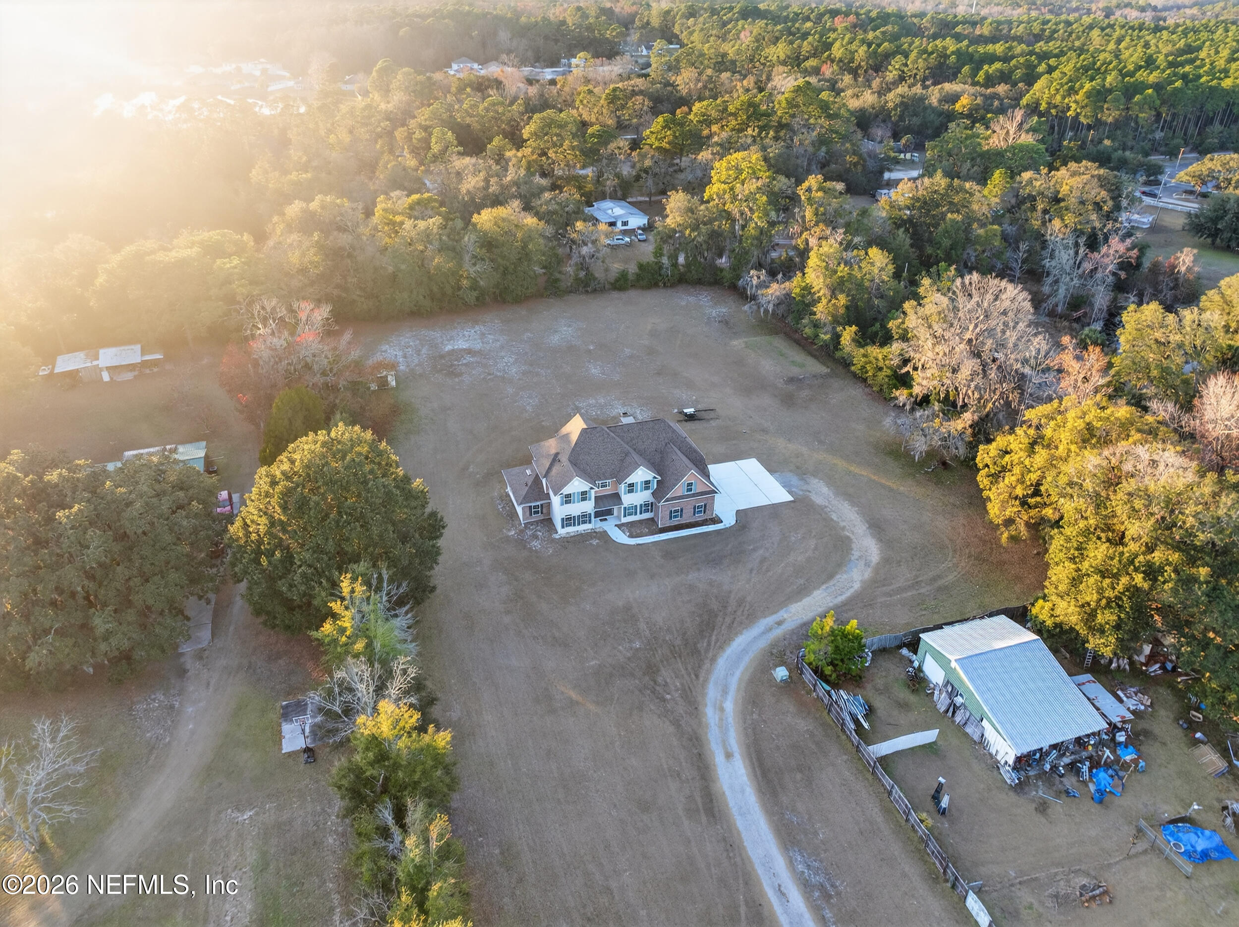 13576 Dunn Creek Road Jacksonville, FL 32218 - Photo 5 of 54 an aerial view of a house with a yard and a garden