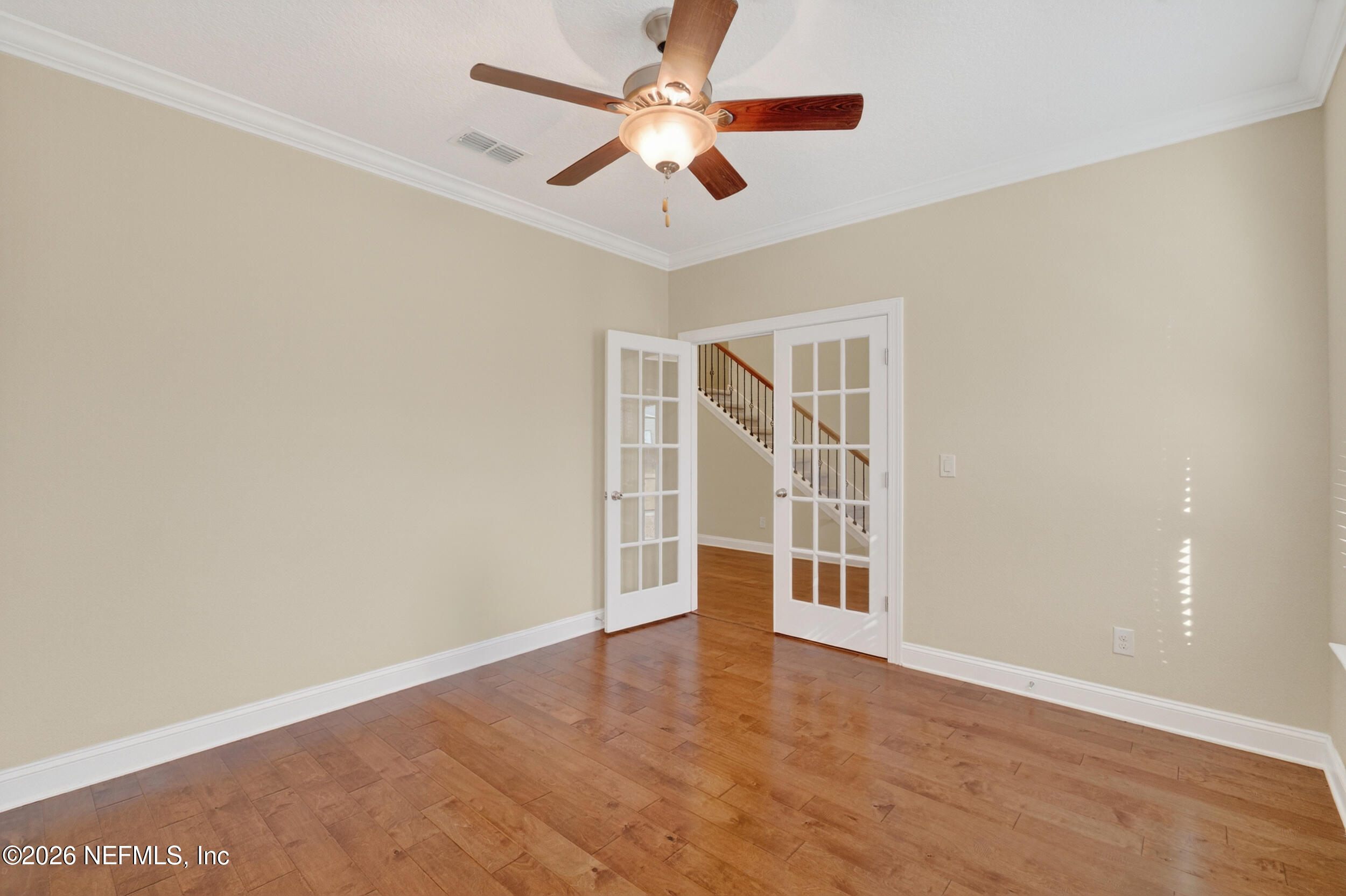 13576 Dunn Creek Road Jacksonville, FL 32218 - Photo 8 of 54 wooden floor in an empty room with a window