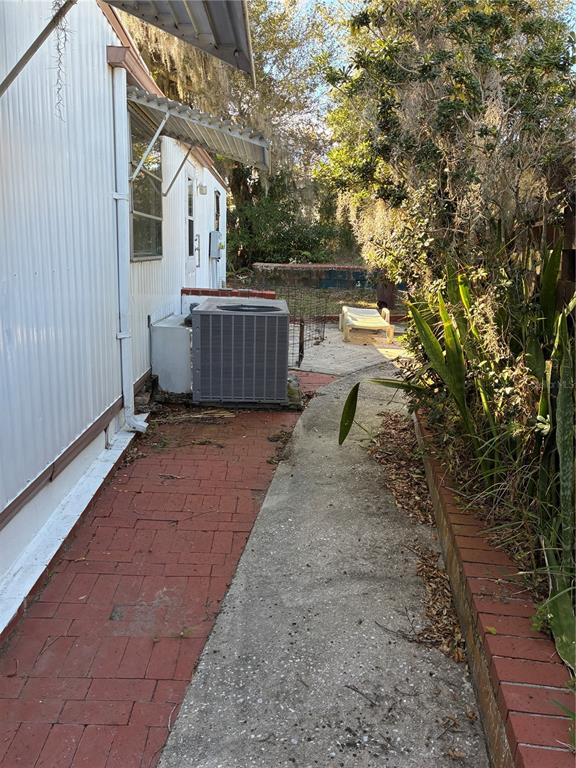 3896 Picciola Road, Unit 213 Fruitland Park, FL 34731 - Photo 3 of 12 a house view with a backyard space