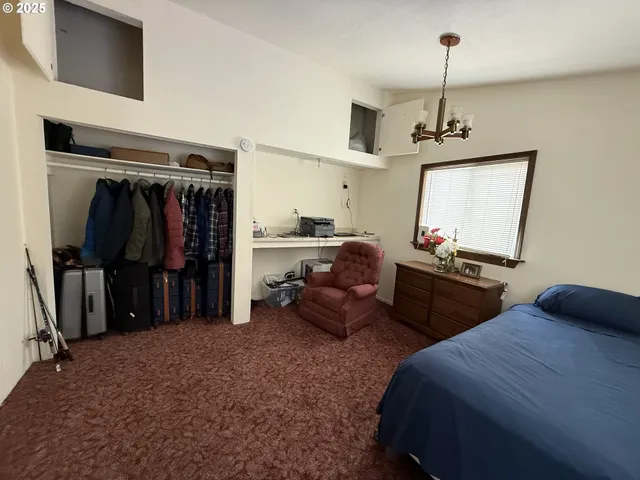 a bedroom with bed and walk in closet