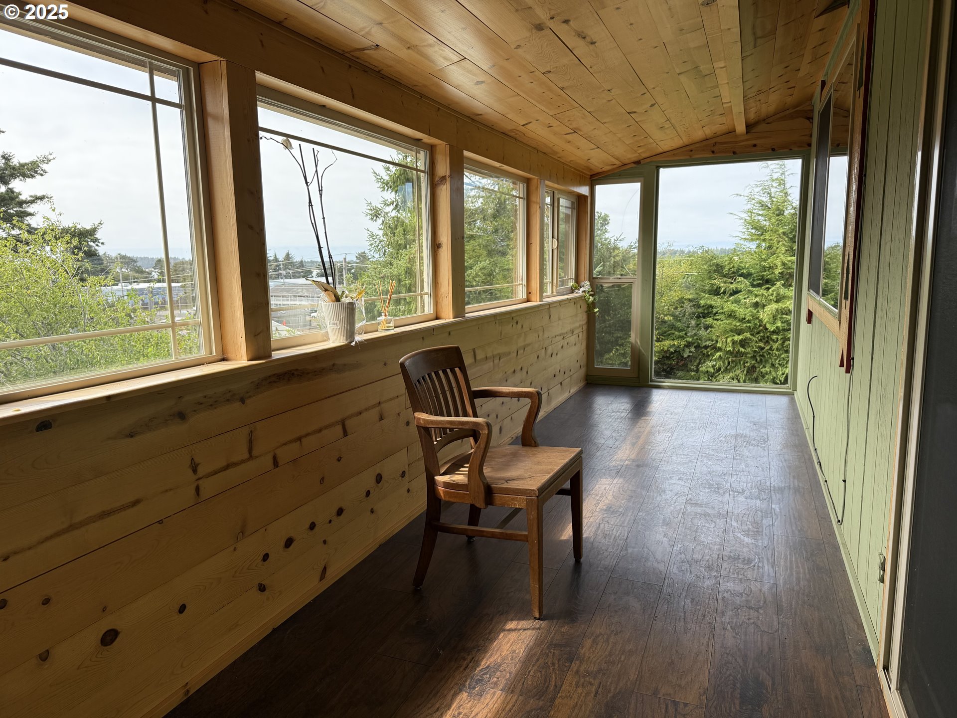715 Jackson Avenue Coos Bay, OR 97420 - Photo 14 of 46 a view of a room with a window and wooden floor