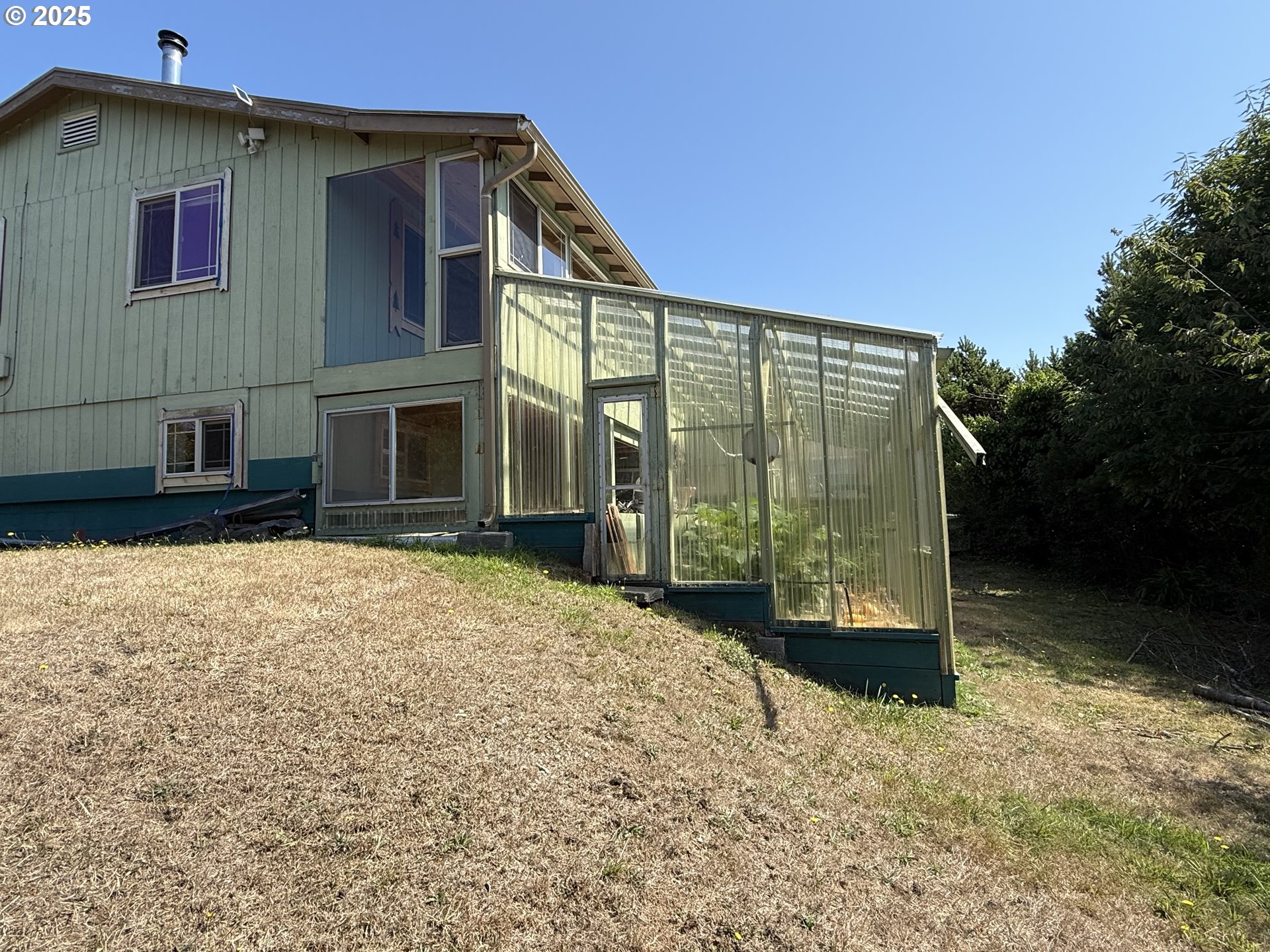 715 Jackson Avenue Coos Bay, OR 97420 - Photo 21 of 46 a view of a house with a yard