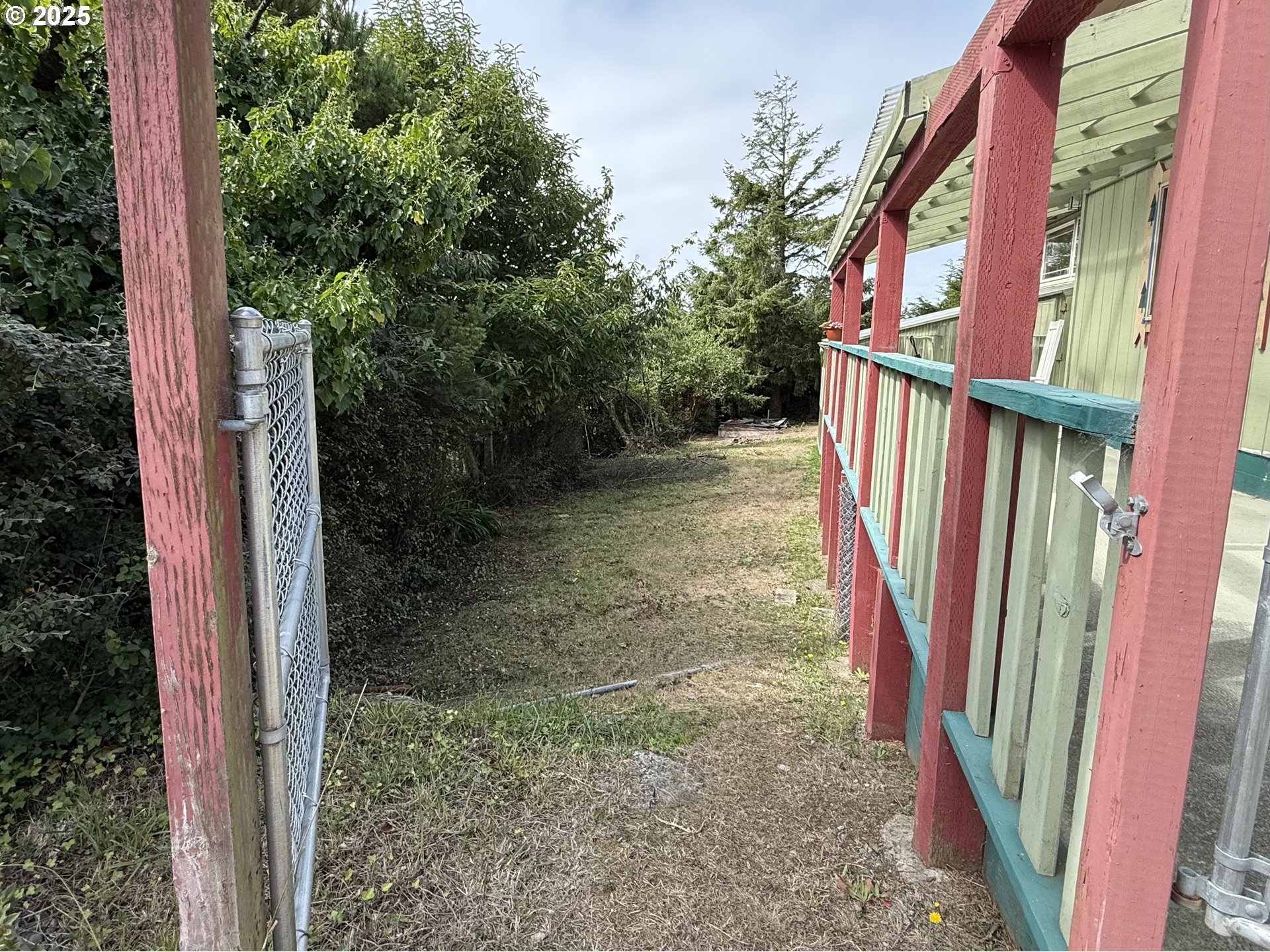 715 Jackson Avenue Coos Bay, OR 97420 - Photo 29 of 46 a view of a yard from a corridor
