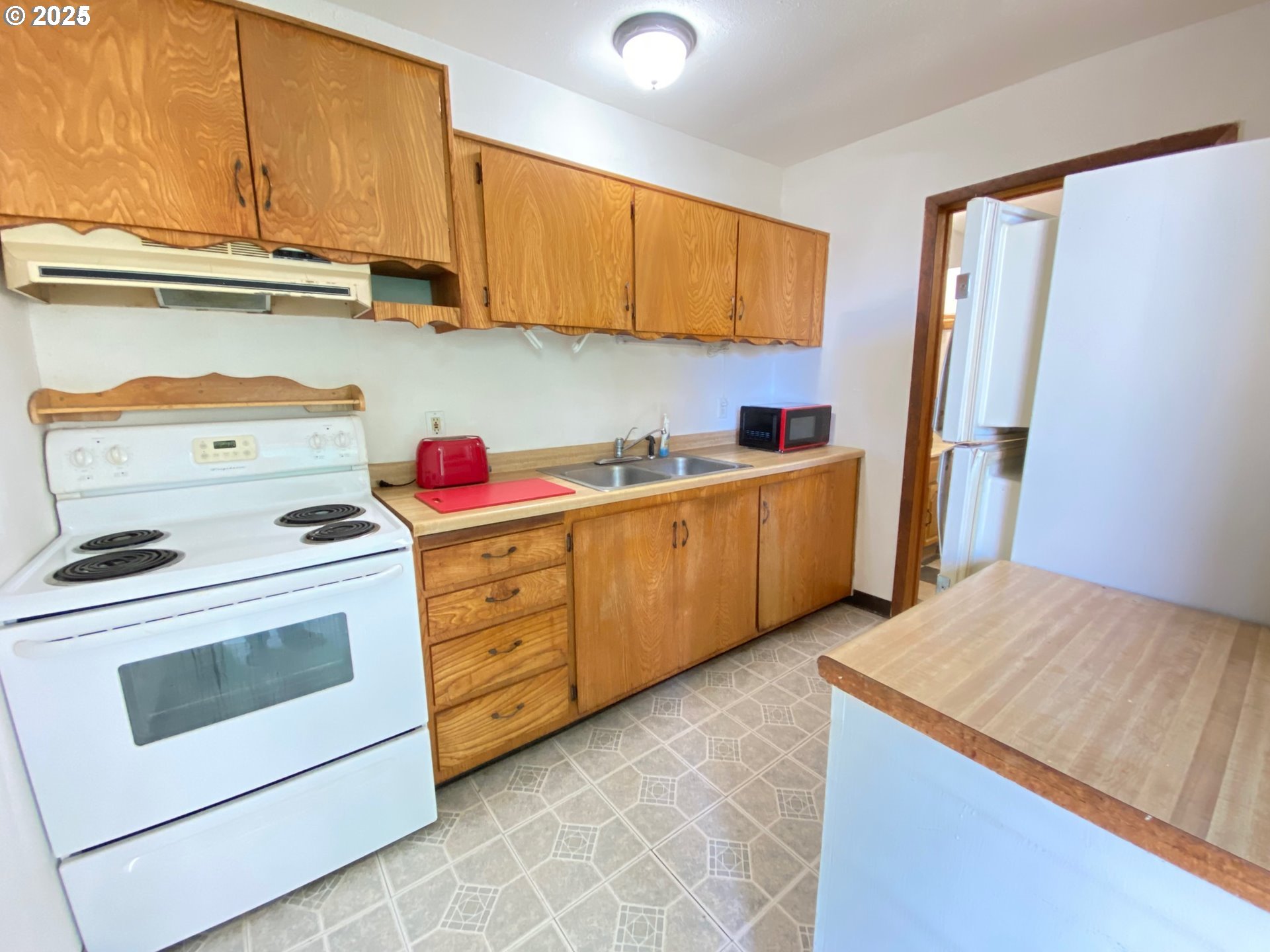 715 Jackson Avenue Coos Bay, OR 97420 - Photo 43 of 46 a kitchen with a stove microwave and cabinets