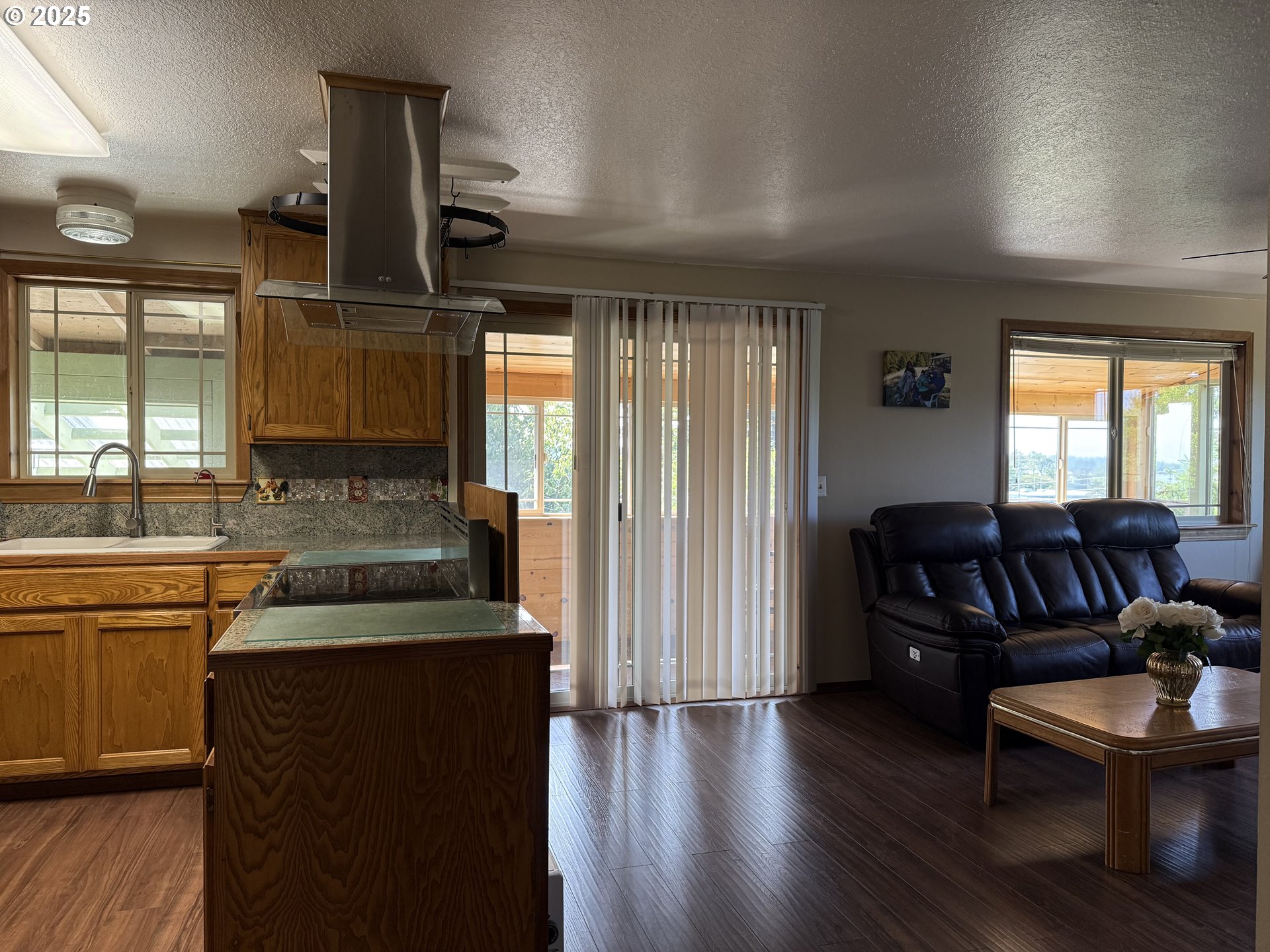 715 Jackson Avenue Coos Bay, OR 97420 - Photo 8 of 46 a living room with furniture and a wooden floor