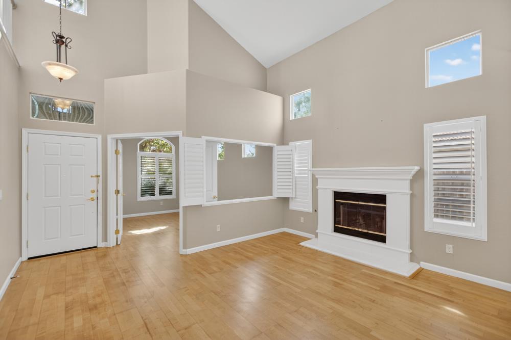 5817 Spring Flower Drive Elk Grove, CA 95757 - Photo 12 of 62 a view of empty room with floor to ceiling window and fireplace