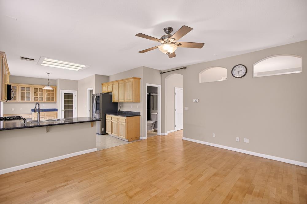5817 Spring Flower Drive Elk Grove, CA 95757 - Photo 15 of 62 a view of a livingroom with furniture wooden floor and chandelier