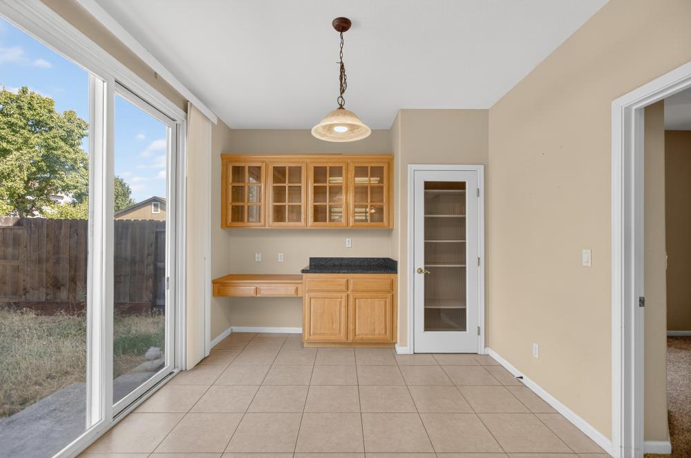 5817 Spring Flower Drive Elk Grove, CA 95757 - Photo 18 of 62 a view of a kitchen with a sink and dishwasher a refrigerator with wooden floor