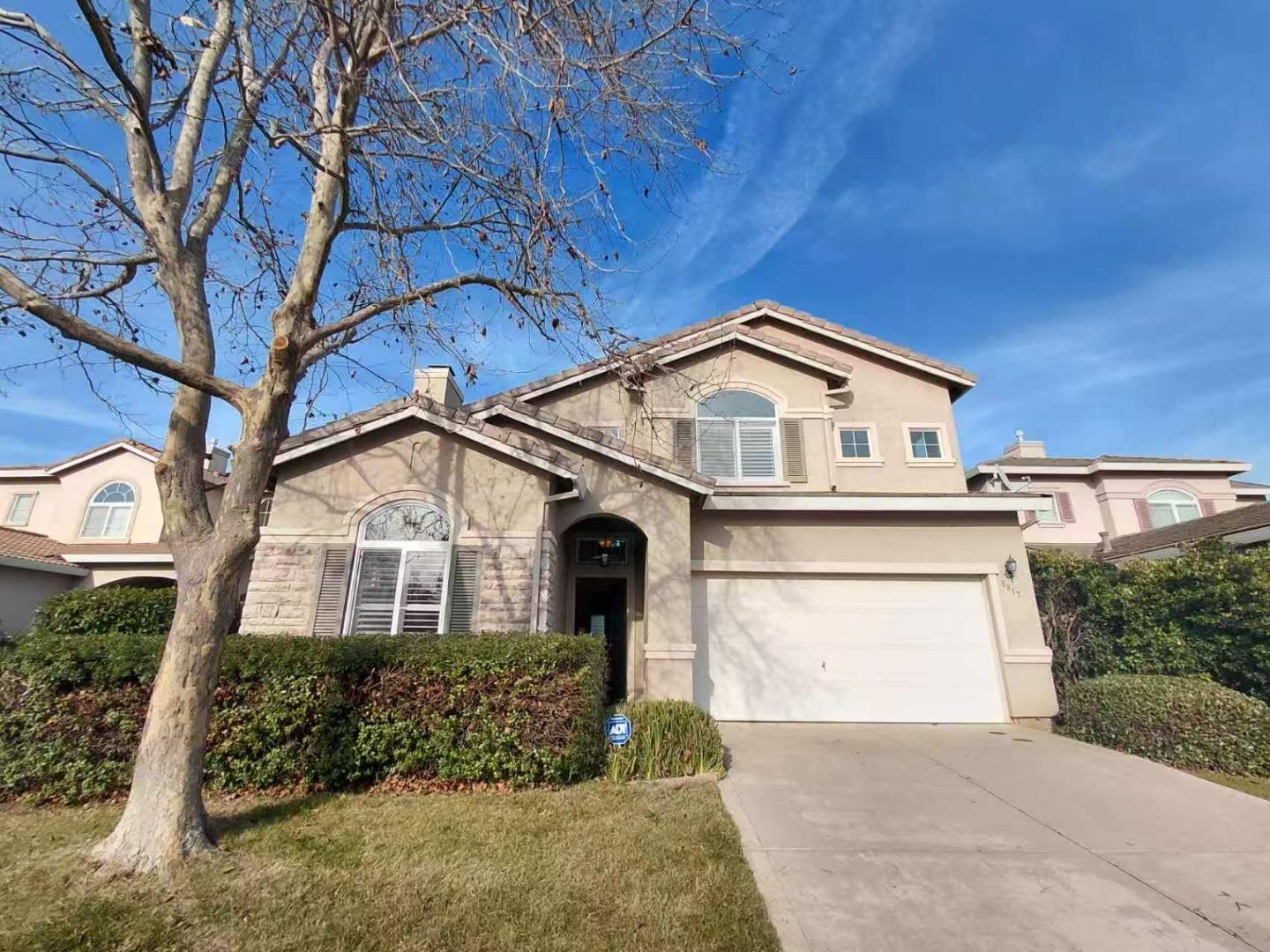 5817 Spring Flower Drive Elk Grove, CA 95757 - Photo 2 of 62 a front view of a house with a yard