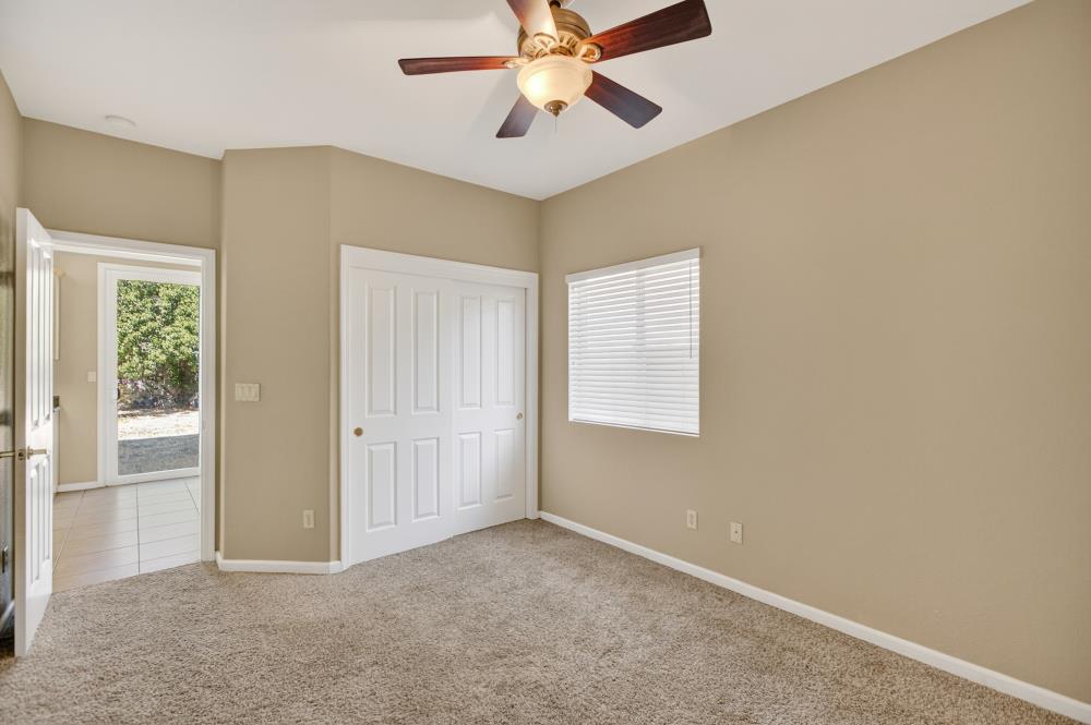 5817 Spring Flower Drive Elk Grove, CA 95757 - Photo 24 of 62 an empty room with windows and fan