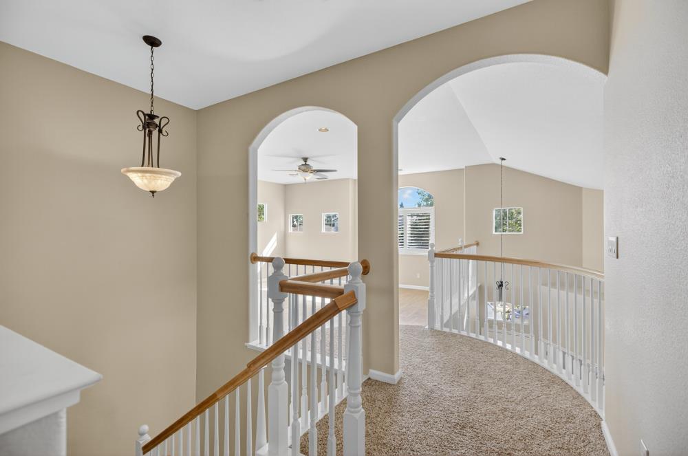 5817 Spring Flower Drive Elk Grove, CA 95757 - Photo 28 of 62 a view of staircase with railing and white walls