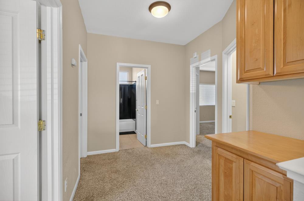 5817 Spring Flower Drive Elk Grove, CA 95757 - Photo 33 of 62 a view of a kitchen cabinets and wooden floor