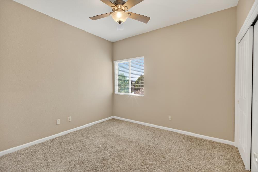 5817 Spring Flower Drive Elk Grove, CA 95757 - Photo 34 of 62 an empty room with a window and a fan