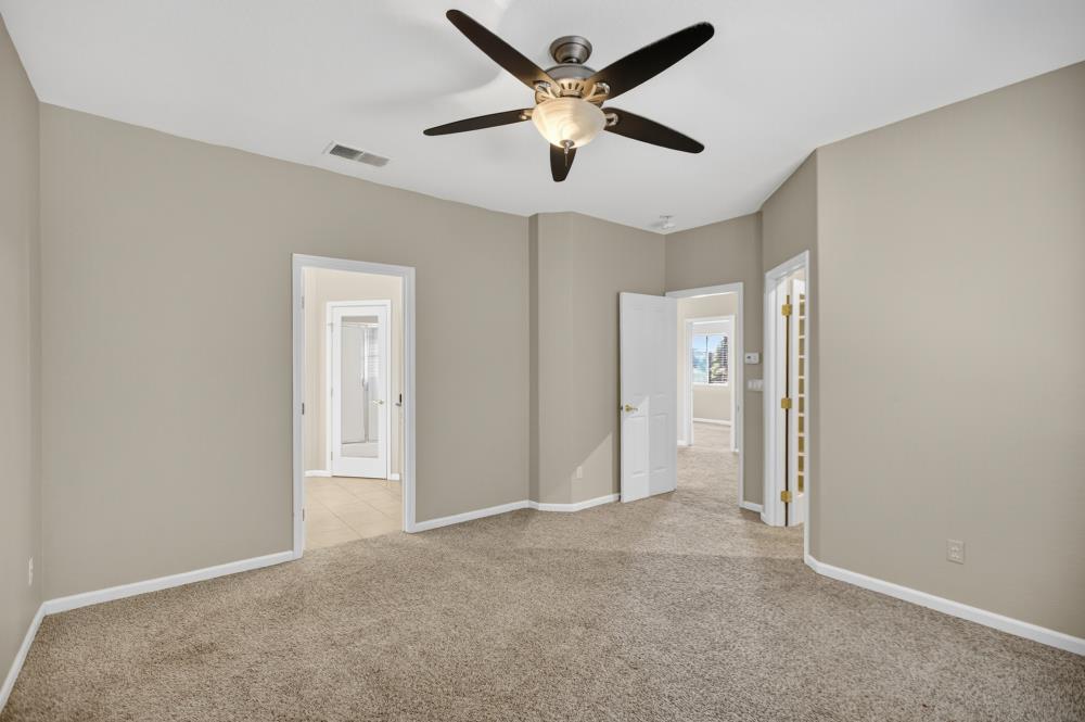 5817 Spring Flower Drive Elk Grove, CA 95757 - Photo 43 of 62 a view of an empty room and a ceiling fan