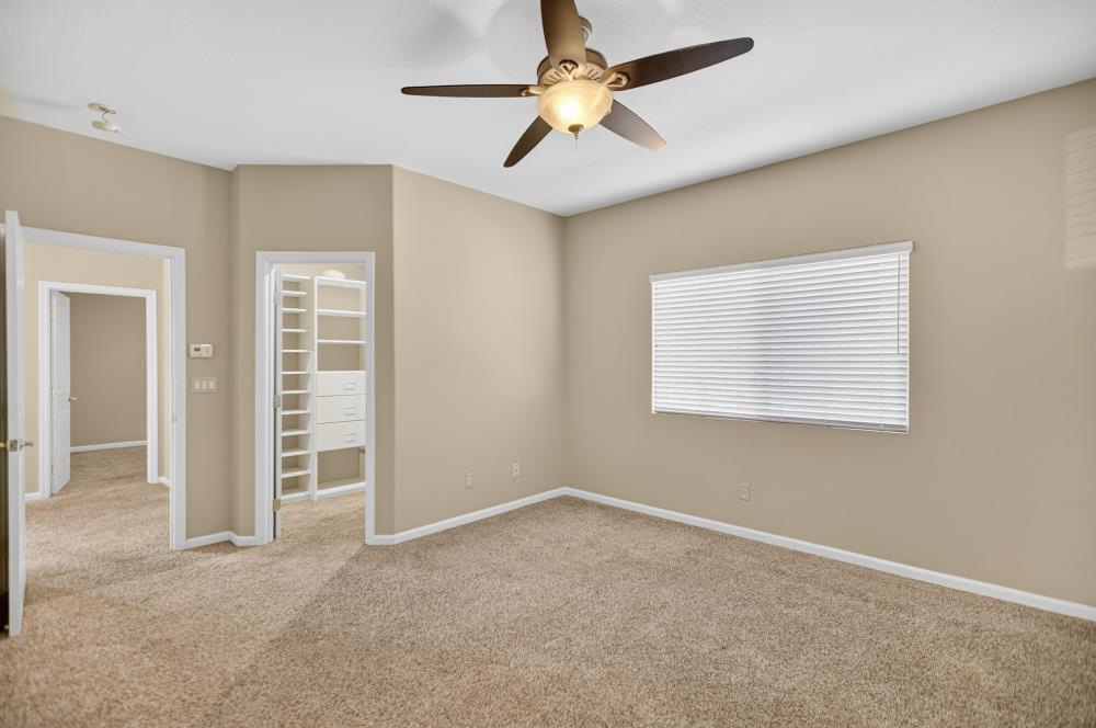 5817 Spring Flower Drive Elk Grove, CA 95757 - Photo 44 of 62 an empty room with windows and fan