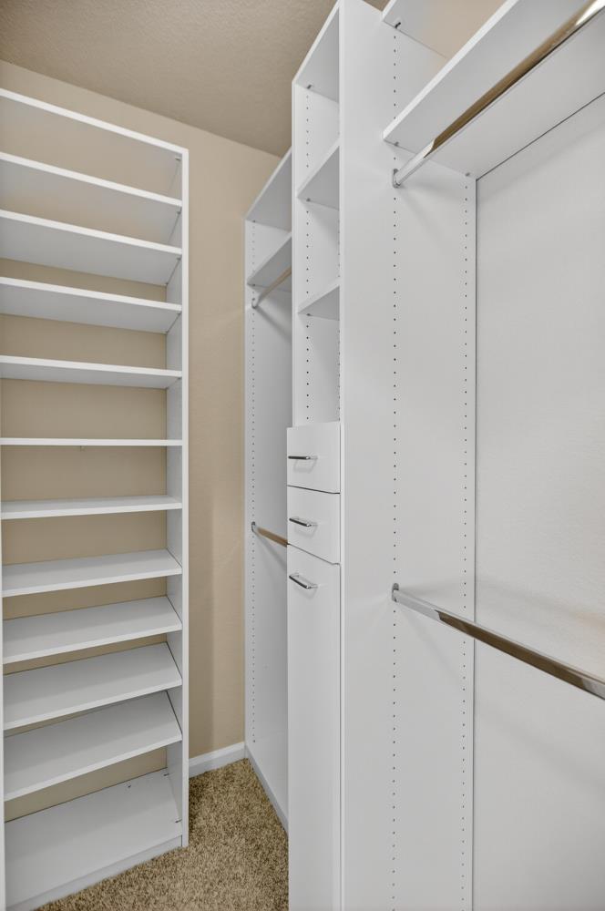 5817 Spring Flower Drive Elk Grove, CA 95757 - Photo 48 of 62 a view of walk in closet with empty racks