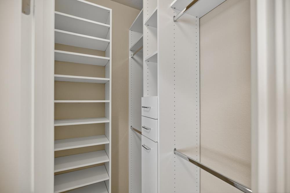 5817 Spring Flower Drive Elk Grove, CA 95757 - Photo 49 of 62 a view of walk in closet with empty racks