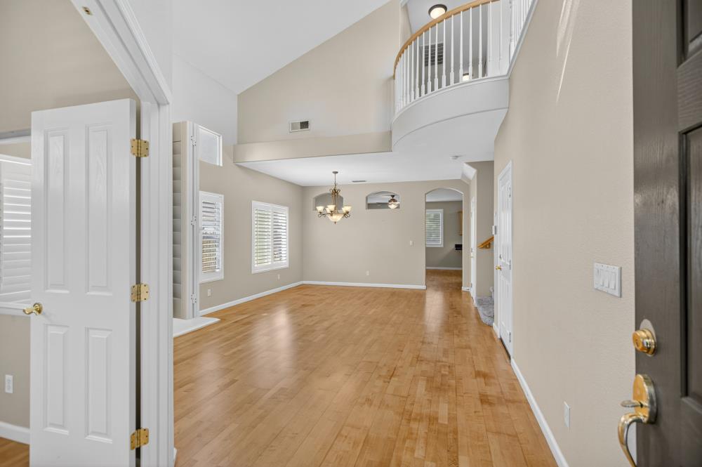 5817 Spring Flower Drive Elk Grove, CA 95757 - Photo 5 of 62 a view of livingroom with hardwood floor and hallway