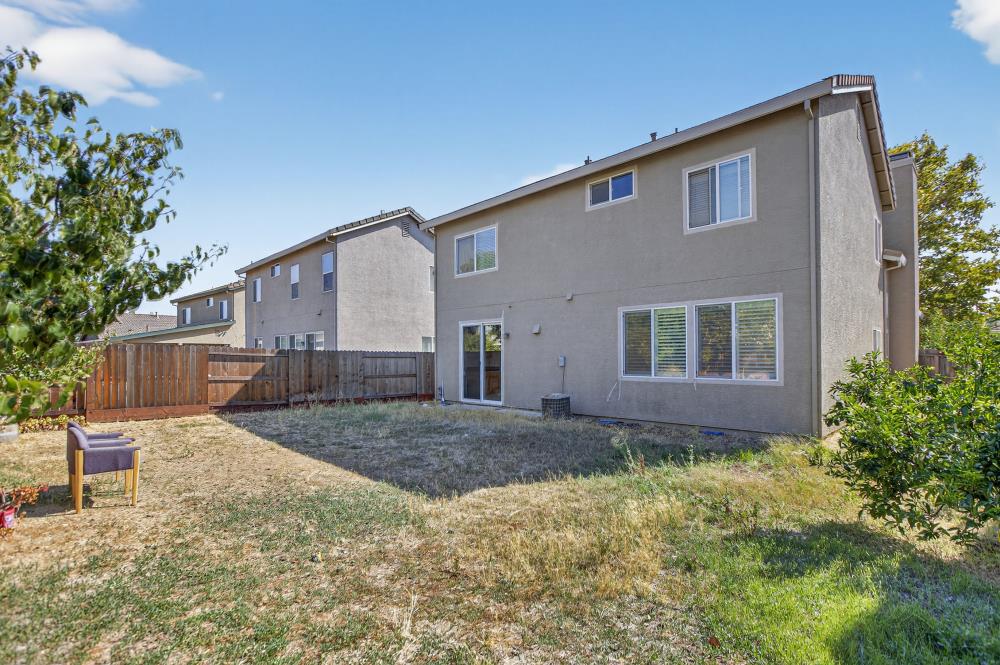 5817 Spring Flower Drive Elk Grove, CA 95757 - Photo 52 of 62 a front view of a house with a yard and garage
