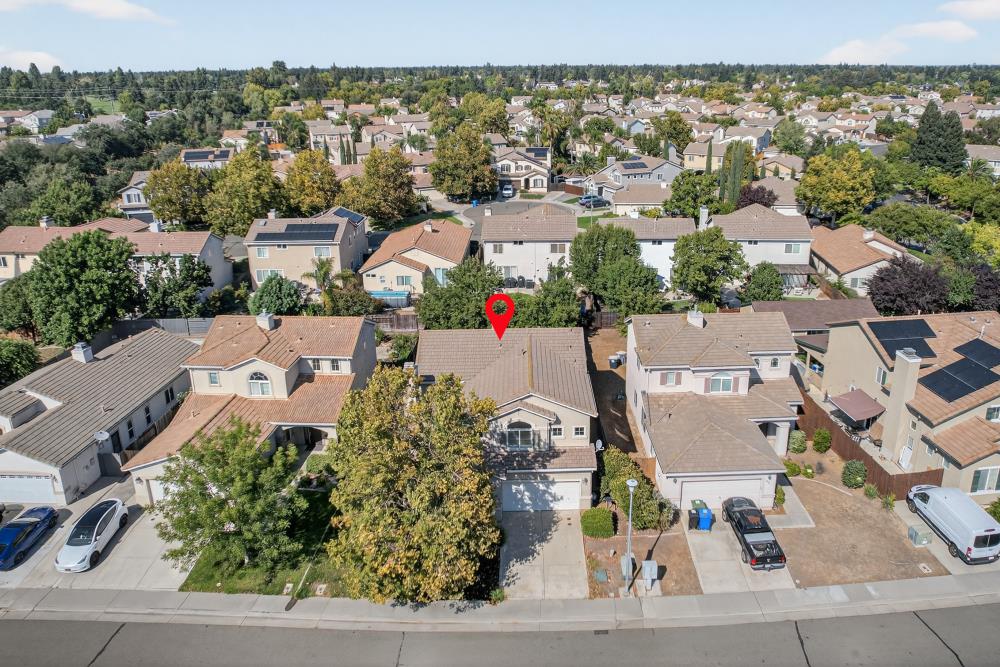 5817 Spring Flower Drive Elk Grove, CA 95757 - Photo 54 of 62 an aerial view of a house with a yard