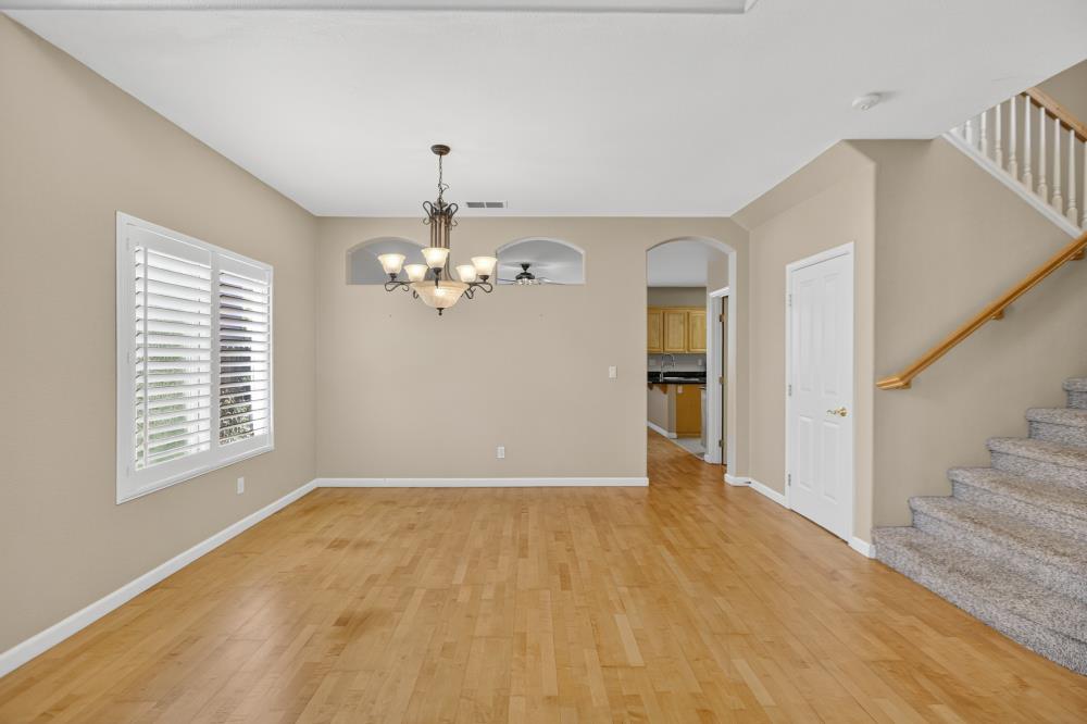 5817 Spring Flower Drive Elk Grove, CA 95757 - Photo 10 of 62 a view of empty room with wooden floor and fan