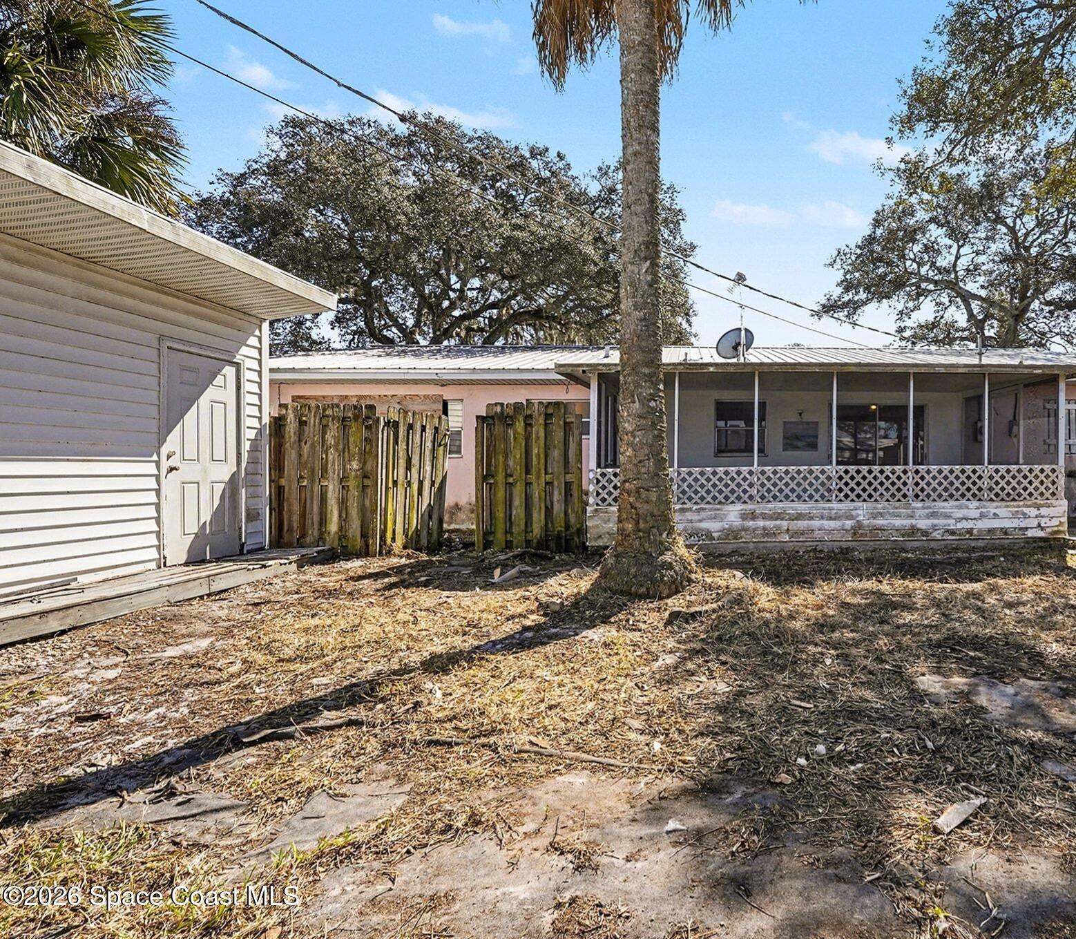 3205 Dade Circle Northeast Palm Bay, FL 32905 - Photo 28 of 35 a house with trees in the background